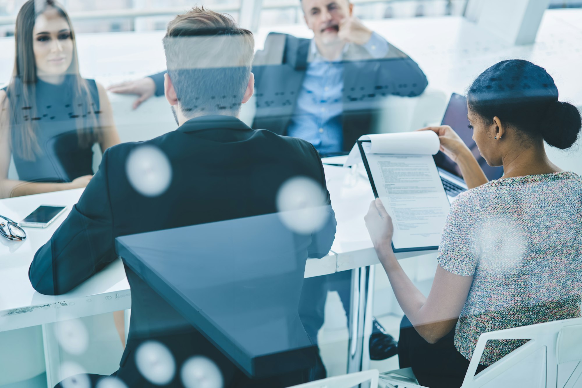 professional colleagues discussing marketing and management during work day in office firm